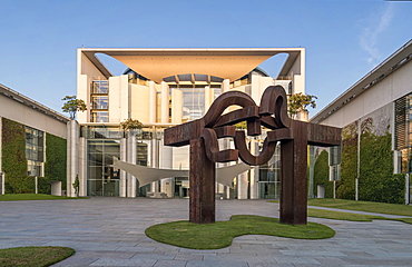 Sunrise at German federal chancellery, Bundeskanzleramt with steel sculpture ''Berlin'' by Basque artist Eduardo Chillida, Berlin, Germany