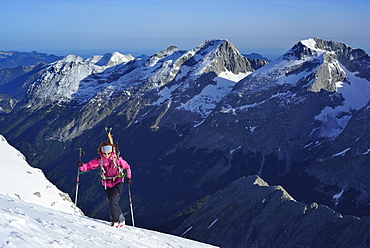 Female back-country skier ascending to Birkkarspitze, Karwendel range, Tyrol, Austria