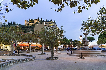 Boules in a square near the harbour, Fortress in the background, Cassis, Cote d Azur, France