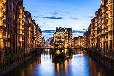 view to the Watercastle in the old Speicherstadt in the twilight, Hafencity of Hamburg, north Germany, Germany