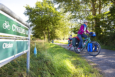 Mother and son on a bicycle tour, Baltic sea, MR, Bornholm, near Olsker, Denmark, Europe