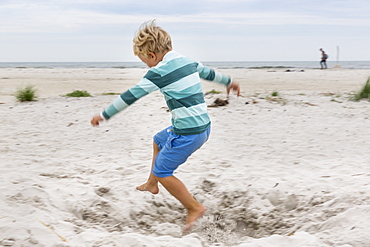 Boy running on the beach, 5 years old, dream beach between Strandmarken und Dueodde, sandy beach, summer, Baltic sea, Bornholm, Strandmarken, Denmark, Europe, MR