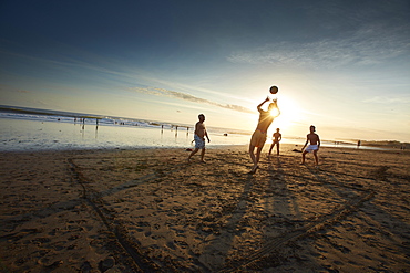 Beachvolley players on the beach of Canggu, Ebbe, Bali, Indonesia