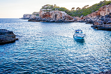 Motorboat next to the Cala s’Almunia beach, Mallorca, Balearic Islands, Spain