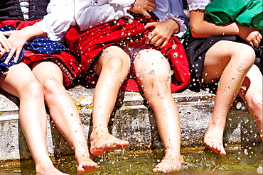 Girls splashing in water, close-up leges, Irsee, Bavaria, Germany