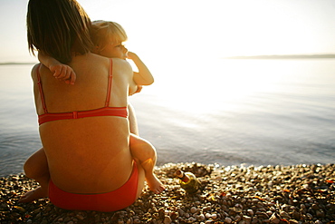 Mother and son at lakeshore of Lake Starnberg, Ammerland, Bavaria, Germany