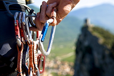 Climber holding carabiner, Arco, Trentino-Alto Adige/Südtirol, Italy