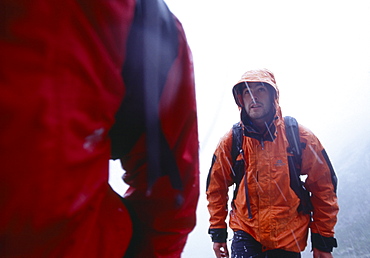 Two mountaineers in the rain, Grisons, Switzerland, Europe