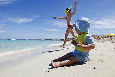 Children playing on the beach, Playa de Llevant, Formentera, Balearic Islands, Spain