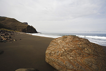 The lonesome beach of El Risco under clouded sky, Parque Natural de Tamadaba, West coast, Gran Canaria, Canary Islands, Spain, Europe