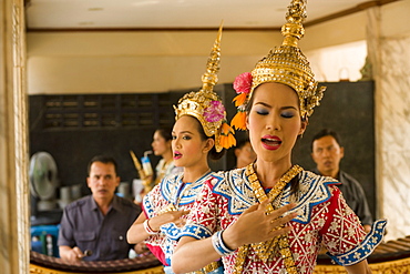 Traditional Thai dancers performing for Brahma, they dancing on request for donations, Erawan Shrine, Ratchadamri Road near Siam Square, Pathum Wan District, Bangkok, Thailand