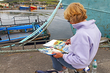 outdoor photo, paintress at the harbour of Dingle, Dingle Peninsula, County Kerry, Ireland, Europe