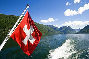 Motorboat with Swiss Flag on Lake Lugano, Lugano, Ticino, Switzerland