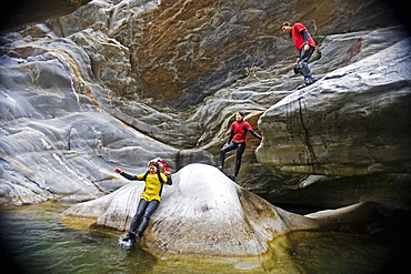 Young woman canyoning, Valle Maggia, Canton of Ticino, Switzerland, MR