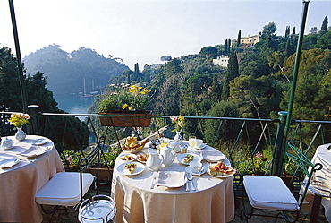 Tables are laid at the terrace of Hotel Splendido, Portofino, Liguria, Italy, Europe