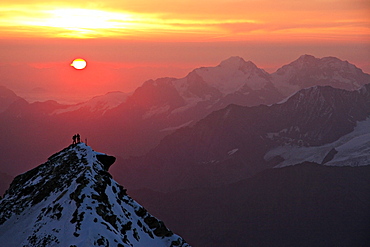 Two climbers on top of second summit of Bishornat at sunrise, Bishorn, 4135 meters, Valais, Wallis, Switzerland, Alps