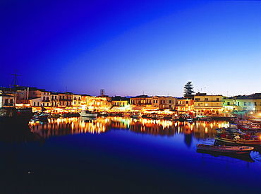 Venetian Harbour at night with restaurants, Réthimnon, Crete, Greece