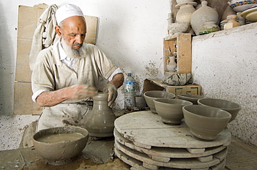 Potter at work in pottery, Fes, Morocco