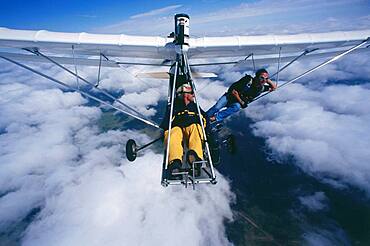 Two parachutists in ultralight airplane