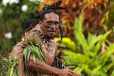 A Marquesan "warrior" performs a traditional dance at a cultural event for passengers on the Aranui 5 (Aranui Cruises) passenger cargo ship, Hatiheu, Nuku Hiva, Marquesas Islands, French Polynesia, South Pacific