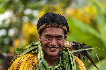 A Marquesan "warrior" smiles at the camera at a cultural event for passengers on the Aranui 5 (Aranui Cruises) passenger cargo ship, Hatiheu, Nuku Hiva, Marquesas Islands, French Polynesia, South Pacific