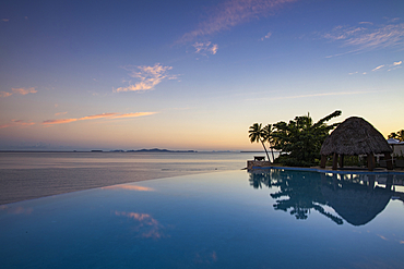 Infinity pool at the Fiji Marriott Resort Momi Bay with a view of the Mamanuca archipelago, Coral Coast, Viti Levu, Fiji Islands, South Pacific