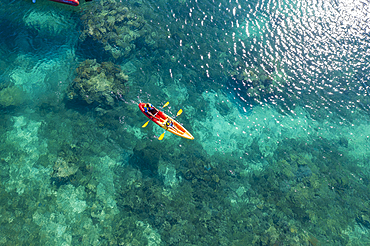 Aerial view of passengers of the cruise ship MV Reef Endeavor (Captain Cook Cruises Fiji) enjoying water sports along a coral reef, Yaqeta, Yangetta Island, Yasawa Group, Fiji Islands, South Pacific