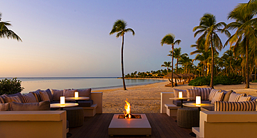 A firepit set on a Caribbean beach. Shot in the fading light of day on an island near Antigua.