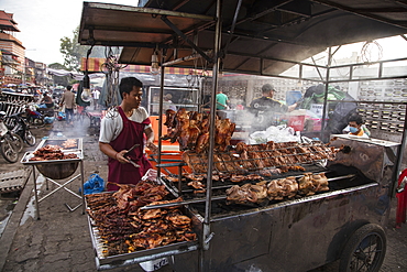 Grilled chicken at a street food stall outside the Phsar Kandal Market, Phnom Penh, Cambodia, Asia