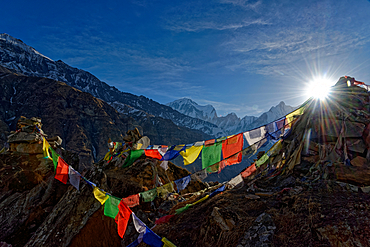 Buddhist prayer flags above Annapurna Base Camp, Nepal, Himalayas, Asia.