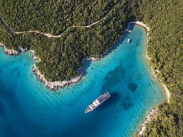 Aerial view of cruise ship in pristine bay at a swim stop for passengers, near Kampor, Primorje-Gorski Kotar, Croatia, Europe