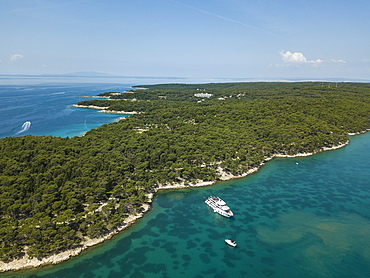 Aerial view of cruise ship in pristine bay at a swim stop for passengers, near Rab, Primorje-Gorski Kotar, Croatia, Europe