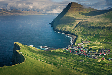 Village of Gjogv on Eysteroy with gorge, sea and mountains, Faroe Islands