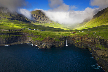 Múlafossur waterfall with Gásadalur village on Vagar island, Faroe Islands