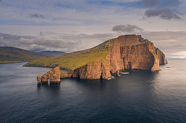 Rock formations of Drangarnier and Vagar Island in sunset, Faroe Islands