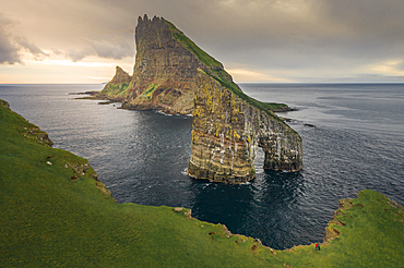 Drangarnier rock formations and Tindholmur island in sunset on Vagar, Faroe Islands