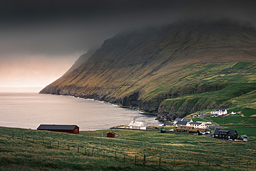 Viðareiði village with seaside church on Vidoy island, Faroe Islands