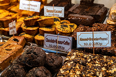 Delicious cakes and other baked goods are for sale at the night market, Luang Prabang, Luang Prabang Province, Laos, Asia