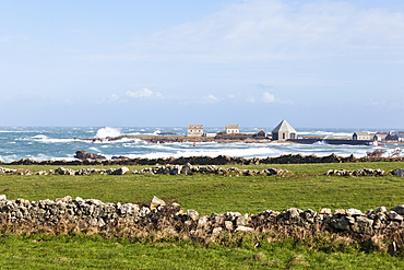 The port of Goury on the Cotentin Peninsula, Normandy, France in a storm. Old stone walls in the foreground.