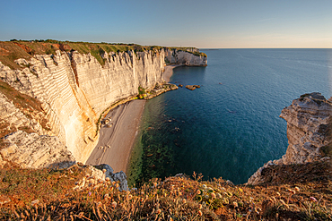 Chalk cliffs cliff at the golden hour near Étretat, Normandy, France.