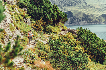 Woman hiking on Lünersee, Vorarlberg, Austria, Europe