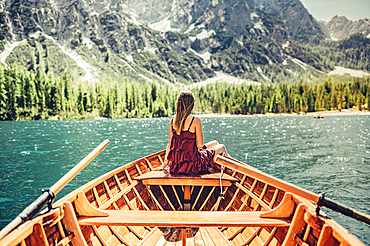 Woman on a boat trip on Lake Braies amid the Dolomites in South Tyrol, Italy, Europe