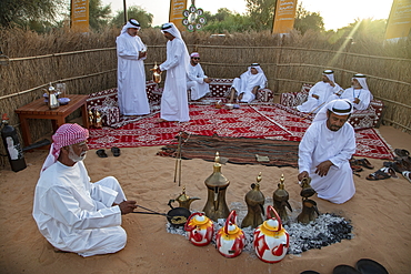 Arab coffee ceremony at a local festival, near Al Ain, Abu Dhabi, United Arab Emirates, Middle East