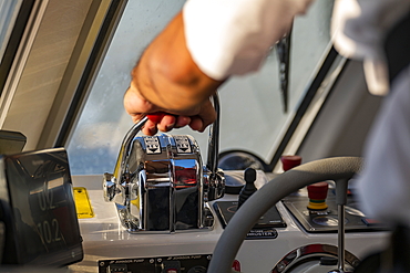 Hand on accelerator of tender boat from expedition cruise ship World Explorer (nicko cruises), Punta del Este, Maldonado Department, Uruguay, South America