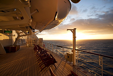 Promenade deck with deck chairs at sunset, Cruise liner Queen Mary 2, Transatlantic, Atlantic ocean