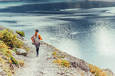 Woman hiking on Lünersee, Vorarlberg, Austria, Europe