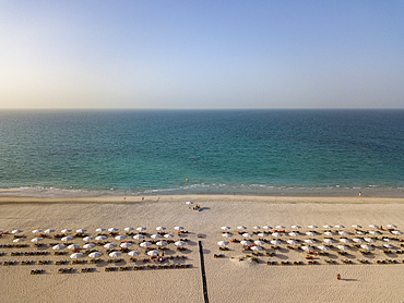 Aerial of beach chairs and umbrellas of Saadiyat Rotana Resort & Villas and sea, Saadiyat Island, Abu Dhabi, United Arab Emirates, Middle East