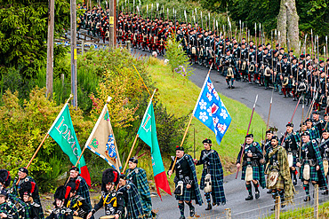 Men of Lonach parade, pipe band in highland dress, Strathdon, Aberdeenshire, Scotland UK