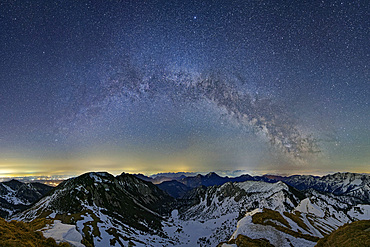 Panorama with Milky Way in the starry sky spanning the Bavarian and Chiemgau Alps, from the Rotwand, Spitzing area, Bavarian Alps, Upper Bavaria, Bavaria, Germany