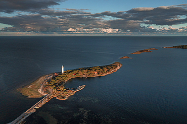 Coast and lighthouse Lange Erik in the north of the island of Öland in the east of Sweden from above in the sun